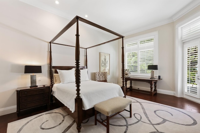 bedroom featuring dark hardwood / wood-style floors and ornamental molding