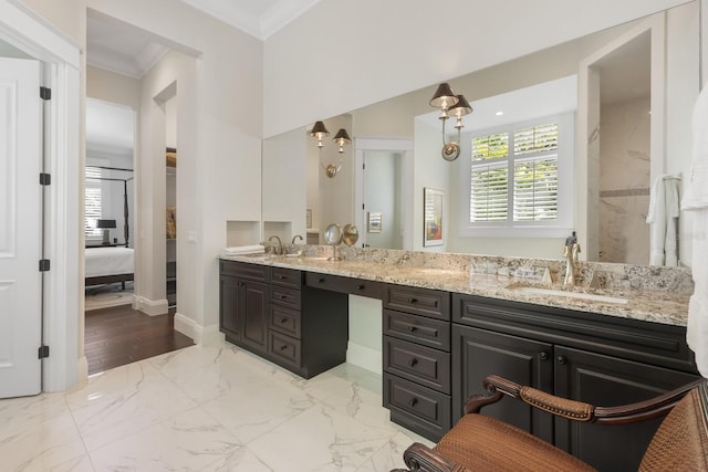 bathroom with vanity and ornamental molding