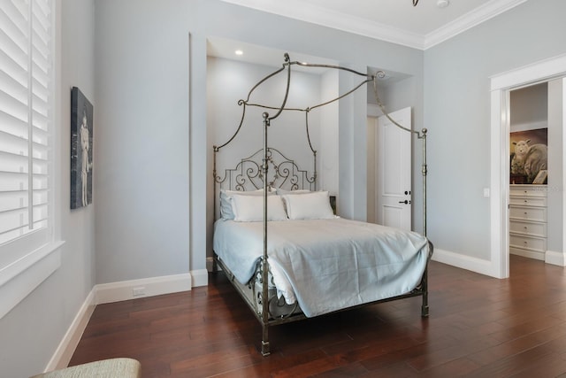 bedroom featuring dark hardwood / wood-style floors and crown molding