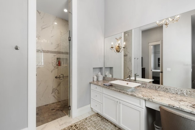 bathroom with vanity and an enclosed shower