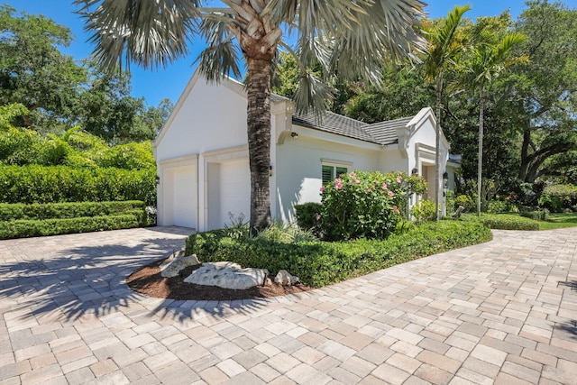 view of side of home with a garage