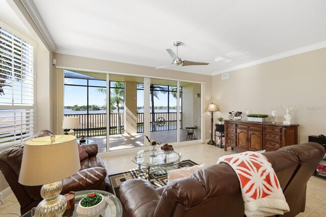 living room featuring crown molding, ceiling fan, and light tile floors