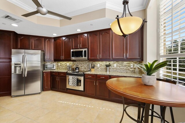 kitchen with backsplash, ornamental molding, and stainless steel appliances