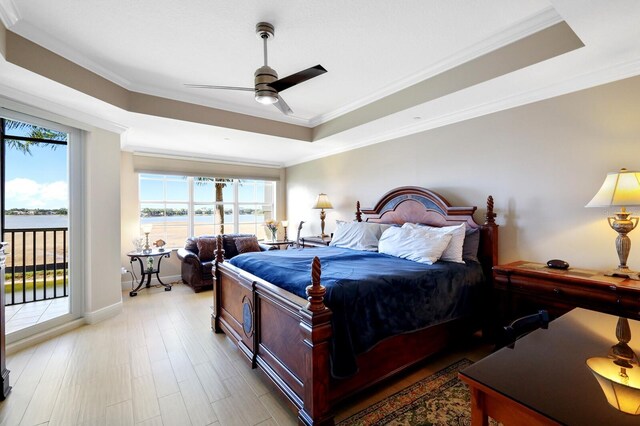 bedroom featuring ornamental molding and multiple windows