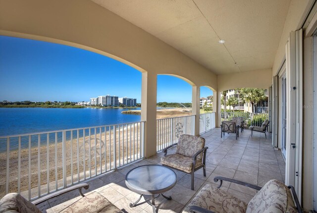 balcony featuring a water view