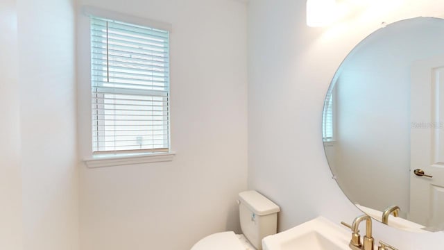 bathroom with toilet and sink