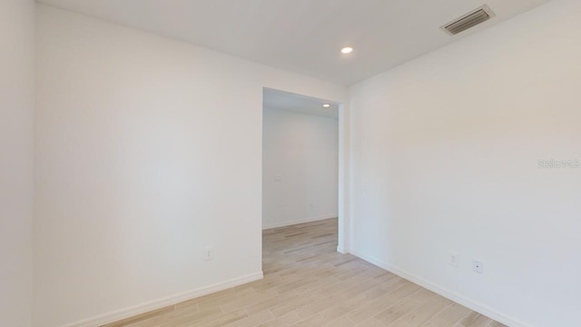 empty room with light hardwood / wood-style floors