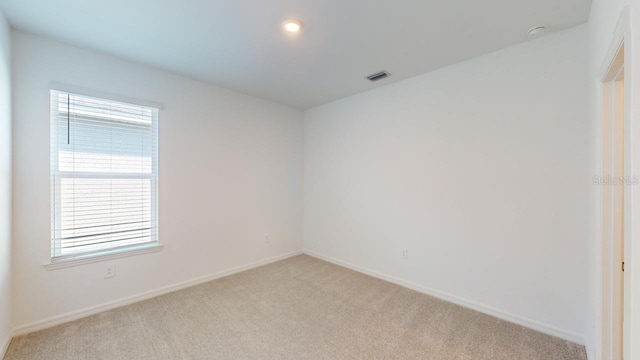 view of carpeted spare room