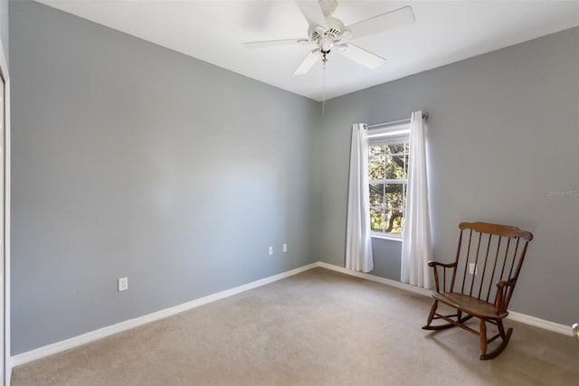 unfurnished room with ceiling fan and light colored carpet