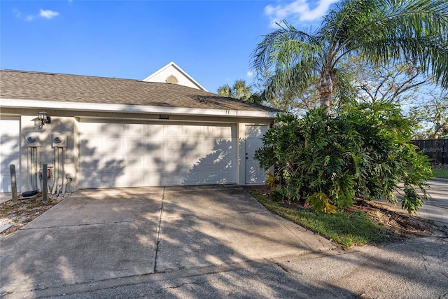 view of side of home featuring a garage