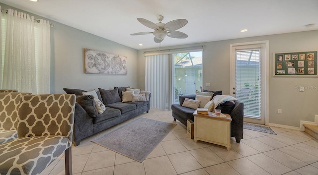 tiled living room featuring ceiling fan