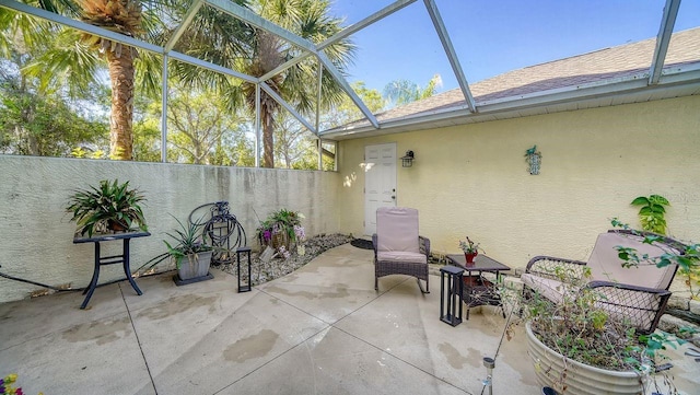 view of patio with a lanai