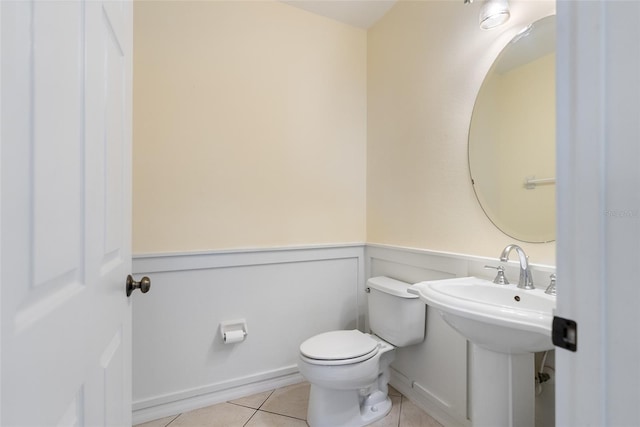 bathroom featuring tile patterned floors and toilet