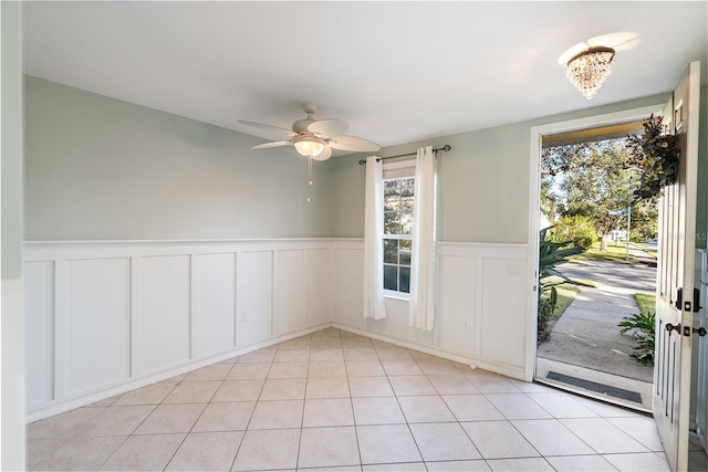 interior space with ceiling fan