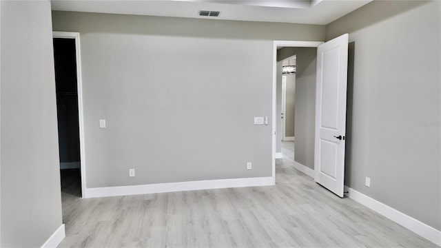 interior space featuring light hardwood / wood-style floors and a spacious closet