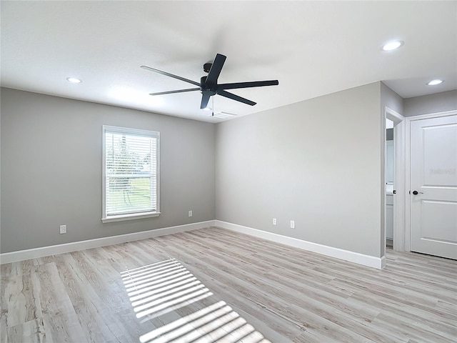 unfurnished room with ceiling fan and light hardwood / wood-style floors