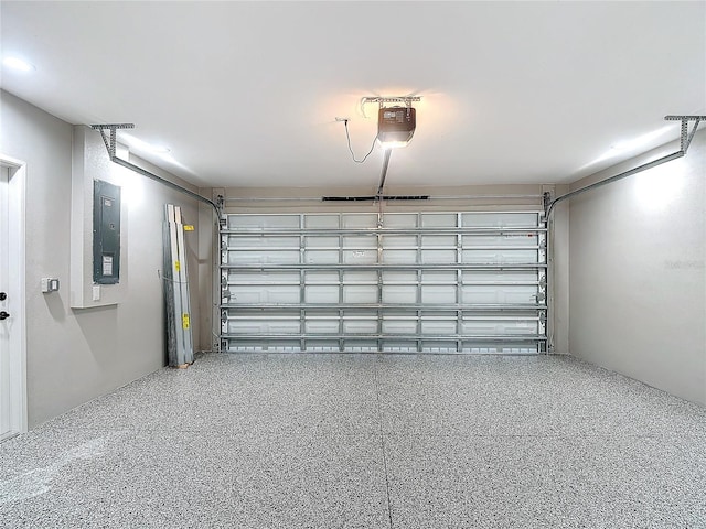 garage featuring a garage door opener and electric panel