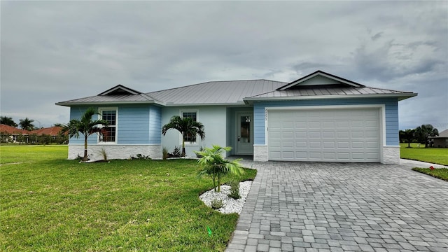 single story home with a garage and a front yard