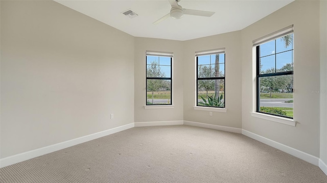 carpeted empty room with ceiling fan