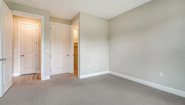 unfurnished bedroom with carpet flooring