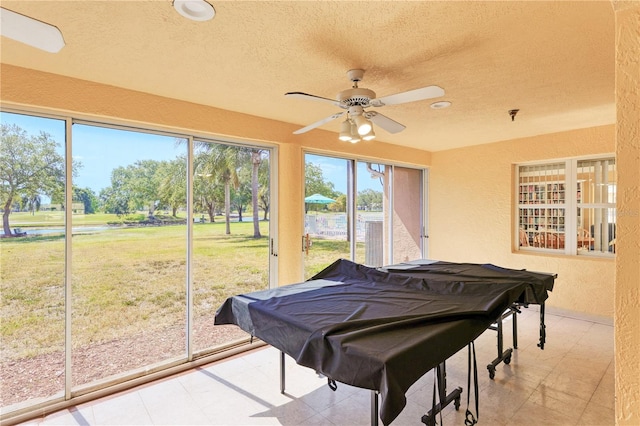 rec room with a textured ceiling, ceiling fan, and pool table