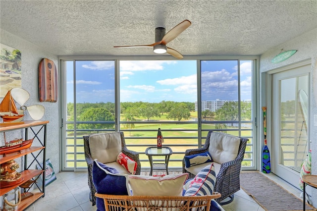 sunroom with ceiling fan and a healthy amount of sunlight