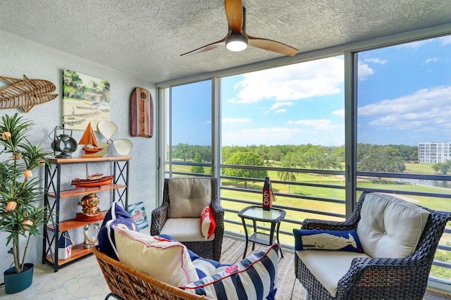 sunroom / solarium with ceiling fan