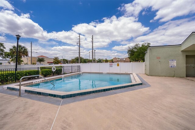 view of swimming pool featuring a patio area