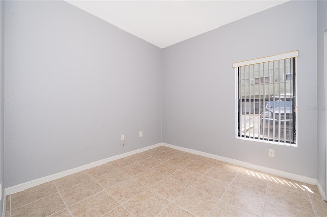 spare room featuring light tile floors