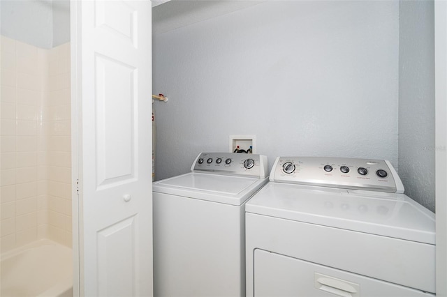 laundry room featuring independent washer and dryer and washer hookup