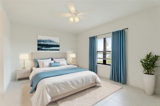 bedroom featuring ceiling fan and light tile patterned flooring