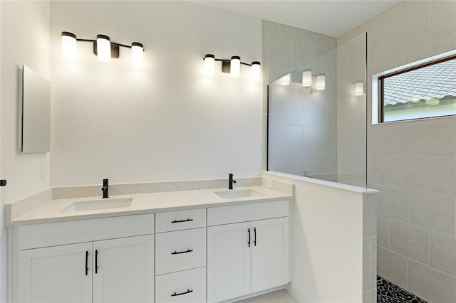 bathroom featuring vanity and a tile shower