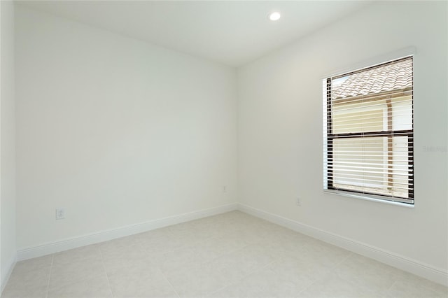 unfurnished room featuring light tile patterned floors