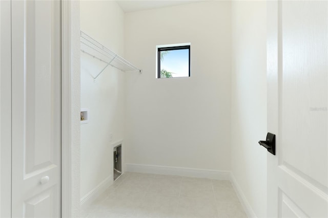 washroom featuring light tile patterned floors and hookup for a washing machine