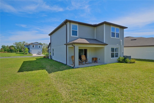 back of house with a patio area, a yard, and central AC unit