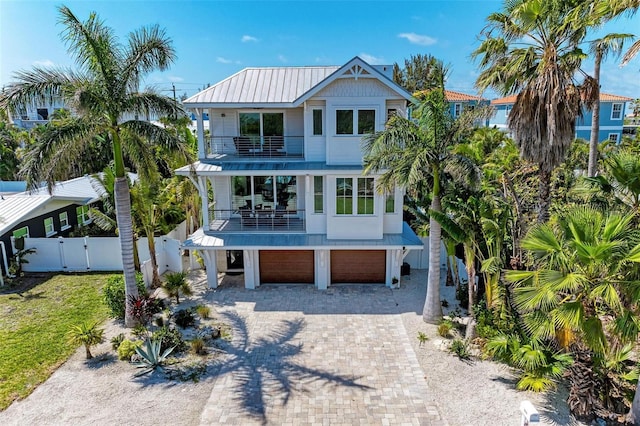 beach home featuring a balcony