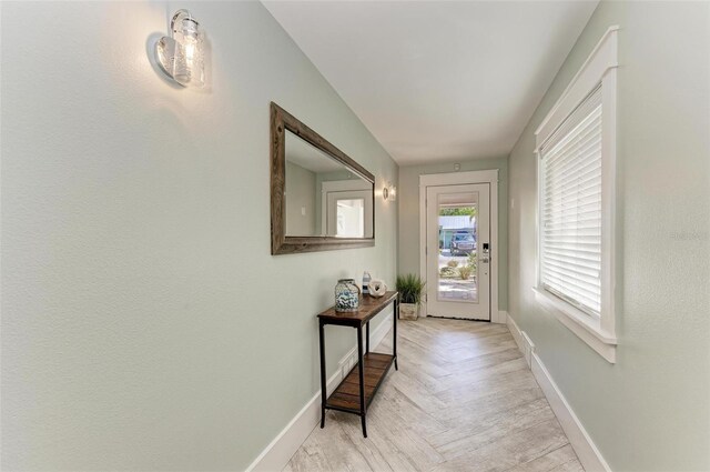 entryway with light parquet floors