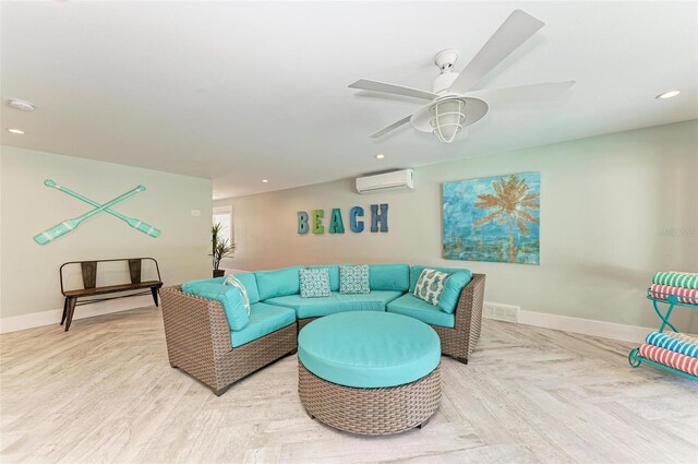 living room featuring an AC wall unit, ceiling fan, and parquet floors