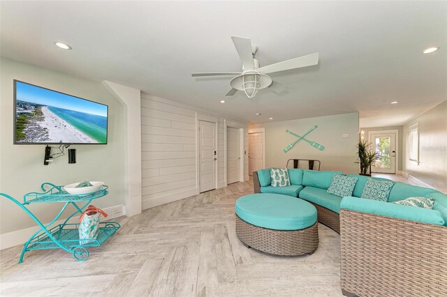 living room with parquet flooring and ceiling fan