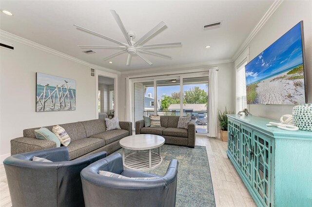 living room with crown molding, light hardwood / wood-style floors, and ceiling fan