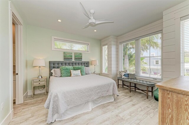 bedroom with light hardwood / wood-style flooring and ceiling fan