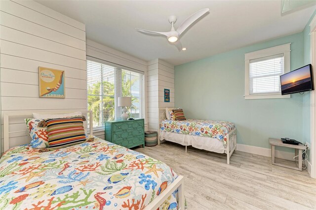 bedroom with hardwood / wood-style flooring and ceiling fan