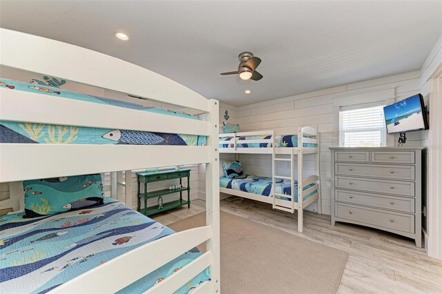 bedroom with light hardwood / wood-style floors and ceiling fan