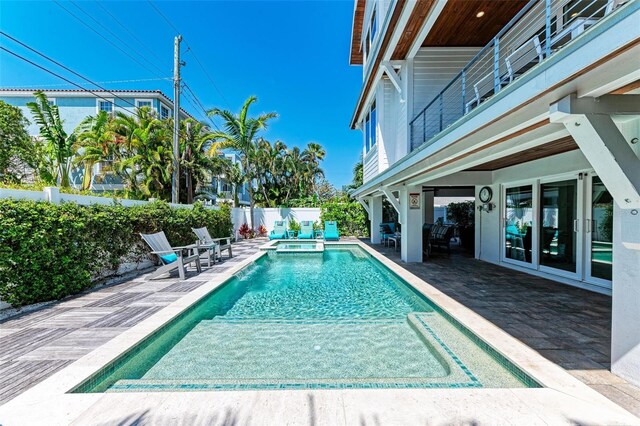 view of swimming pool featuring a patio area