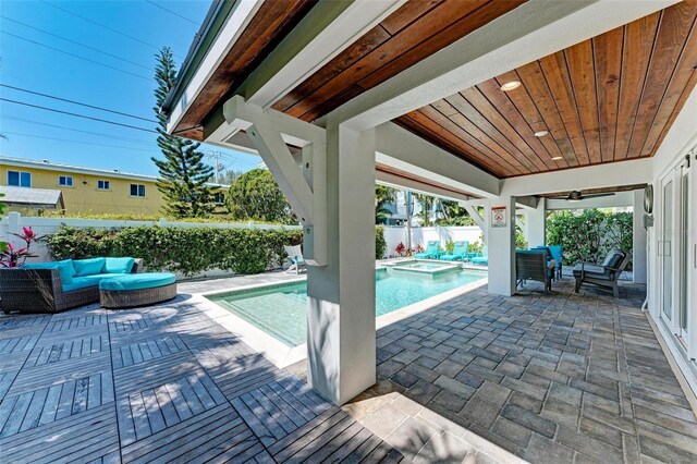 exterior space with a patio, ceiling fan, and an outdoor hangout area