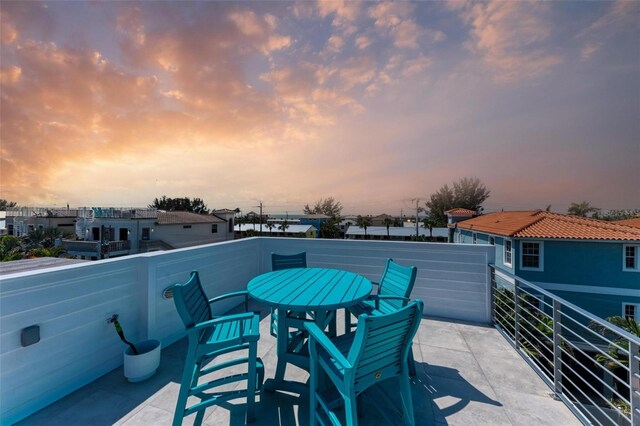 patio terrace at dusk with a balcony