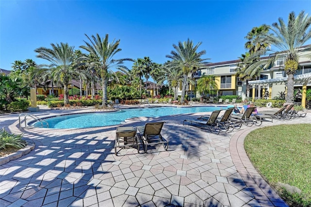 view of swimming pool with a patio area and a pergola