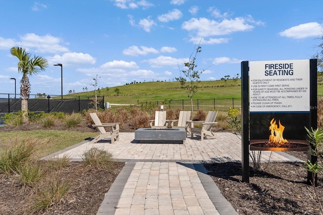 view of patio featuring a rural view and a fire pit