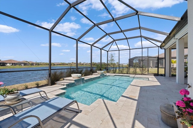 view of pool featuring pool water feature, a patio, a water view, and glass enclosure