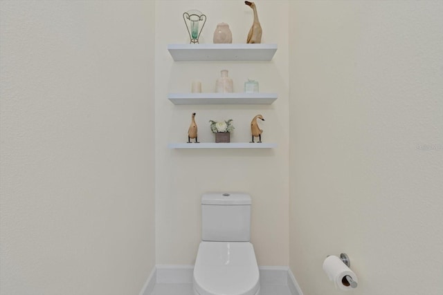 bathroom featuring tile patterned floors and toilet